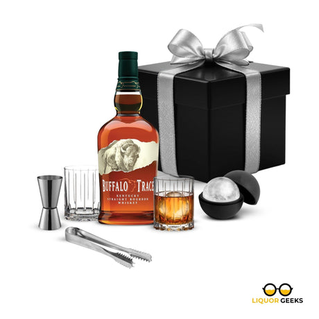 Buffalo Trace bourbon bottle with cocktail accessories and a gift box on a white background