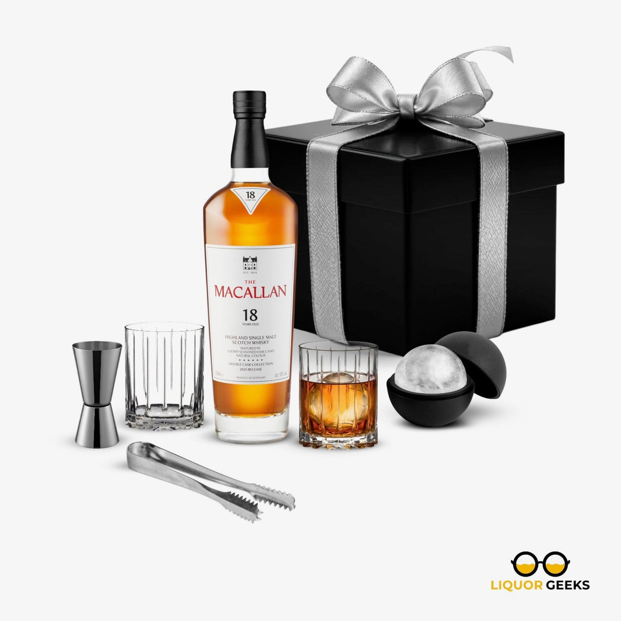 Macallan 18 whiskey bottle with cocktail accessories and a gift box on a white background