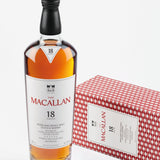 The Macallan 18-year-old whisky bottle with a box on a white background
