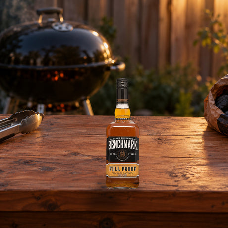Benchmark Full Proof Kentucky Straight Bourbon Whiskey charcoal grill table - Liquor Geeks