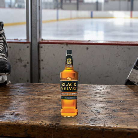 Black Velvet Toasted Caramel Flavored Whiskey hockey rink bench - Liquor Geeks